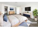 A bright and airy main bedroom featuring modern decor and a walk-in closet at 148 Campbelltown Ave, Henderson, NV 89015
