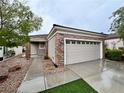Attractive single-story home featuring a well-maintained front yard and a two-car garage at 2558 Divine Sky Dr, Henderson, NV 89044