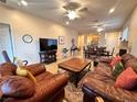 Comfortable living room featuring tile floors, ample seating, and an open floor plan at 2558 Divine Sky Dr, Henderson, NV 89044
