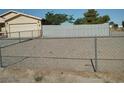Chain link fence securing a large gravel backyard at 2920 Malibou Ave, Pahrump, NV 89048