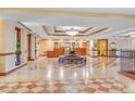 Stunning lobby featuring patterned tile floors, contemporary lighting, and a reception area at 30 Strada Di Villaggio # 306, Henderson, NV 89011
