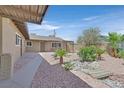 The beautiful backyard has desert landscaping, a decorative rock garden, and a serene outdoor space at 3101 Greenbriar Dr, Las Vegas, NV 89121