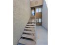 Outdoor carpeted staircase leading to a unit in the condo complex at 3151 Soaring Gulls Dr # 2101, Las Vegas, NV 89128