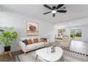 Inviting living room with a comfortable sofa, stylish decor, and an open view to the dining area at 343 W Basic Rd, Henderson, NV 89015