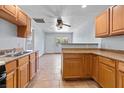 Functional kitchen with light wood cabinetry, a breakfast bar, and double sink at 4000 Visby Ln, Las Vegas, NV 89119