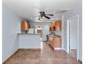 This kitchen features light wood cabinets, a breakfast bar, and ceramic tile flooring at 4000 Visby Ln, Las Vegas, NV 89119