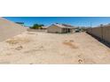 Large, blank canvas backyard offers endless possibilities for creating your ideal outdoor space at 4255 Breezy Point Ln, Las Vegas, NV 89115