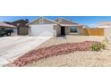 Charming single-story home features a low maintenance xeriscaped front yard and a two car garage at 4255 Breezy Point Ln, Las Vegas, NV 89115