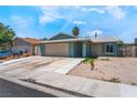 Charming single-Gathering home featuring an attached garage, and xeriscaped front yard at 508 Purcell Dr, Las Vegas, NV 89107
