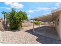 Large backyard with a covered patio and low-maintenance desert landscaping at 5245 Hillman Ave, Las Vegas, NV 89142