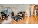 Bright living room boasts hardwood floors and a vaulted ceiling at 5401 Bugle Way # 103, Las Vegas, NV 89108