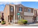 Two-story home featuring an attached two-car garage and well-maintained landscaping at 9021 Last Hope Ave, Las Vegas, NV 89178