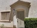 Charming entryway with security door and well-manicured shrubbery at 9333 Leaping Deer Pl # 103, Las Vegas, NV 89178