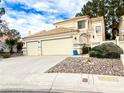 Charming two-story home featuring a spacious three-car garage and landscaped front yard at 9552 Wooden Pier Way, Las Vegas, NV 89117