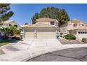 Inviting home with a well-manicured lawn, a tile roof, and a convenient two-car garage at 9552 Wooden Pier Way, Las Vegas, NV 89117