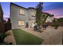 This backyard features low maintenance rock landscaping and an artificial turf area at 9872 Chief Sky St, Las Vegas, NV 89178