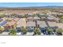 Charming two-story homes in a well-maintained neighborhood with desert landscaping and mountain views at 9872 Chief Sky St, Las Vegas, NV 89178