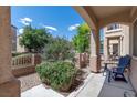 Cozy front porch sitting area to enjoy the exterior neighborhood views at 9962 Derby Creek Way, Las Vegas, NV 89148