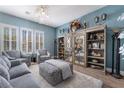 Cozy living room with modern decor, stylish furniture, and a decorative chandelier at 10370 Sweet Laurel St St, Las Vegas, NV 89178