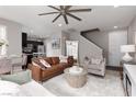 A comfortable and open living room space with a modern kitchen view and great lighting at 11256 Rainbow Peak Ave # 202, Las Vegas, NV 89135