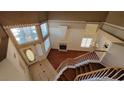 View from the staircase showing a fireplace, hardwood floors, chandelier, and tiled entryway at 1211 Silver Knoll Ave, Las Vegas, NV 89123