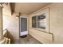 View of an apartment's porch featuring a window, door, and a column on the left side at 1557 Lake Placid Ter # 1557, Henderson, NV 89014