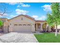 Beautiful single-story home with a well-maintained lawn, two-car garage, and attractive architectural details at 177 Rocky Star St, Henderson, NV 89012