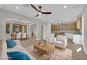Bright open-concept living area featuring modern furniture, wood floors, and lots of natural light at 177 Rocky Star St, Henderson, NV 89012