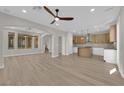 Spacious open-concept living area featuring wood floors, modern fixtures, and lots of natural light at 177 Rocky Star St, Henderson, NV 89012