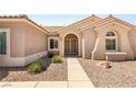 Home's front entrance with gravel yard at 2069 Colvin Run Dr, Henderson, NV 89052