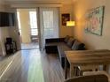 Inviting living room with an outdoor patio and modern decor at 260 E Flamingo Rd # 228, Las Vegas, NV 89169