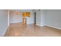 Spacious living room featuring wood floors and an open layout to the kitchen at 3318 N Decatur Blvd # 2110, Las Vegas, NV 89130