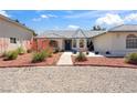 Charming single-story home with manicured landscaping and a tile roof at 3581 Mallard Ave, Pahrump, NV 89048