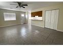 Open living area features tile flooring, abundant natural light and neutral paint scheme at 4189 Studio St, Las Vegas, NV 89115
