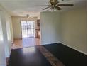 Comfortable living room showcasing hardwood flooring and views into the kitchen area at 4437 Sherrill Ave, Las Vegas, NV 89110