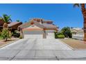 Lovely two-story home with a three-car garage and manicured front yard in a quiet neighborhood at 4835 Willow Glen Dr, Las Vegas, NV 89147
