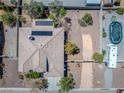 Aerial view of home featuring solar panels on roof and RV parking at 565 Mazelle Ln, Pahrump, NV 89060