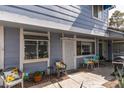 Cozy home exterior with outdoor seating area, perfect for relaxing and entertaining guests at 5831 Medallion Dr # 103, Las Vegas, NV 89122