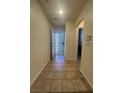 Tiled entryway featuring modern door and neutral paint, creating a welcoming and clean space at 6545 Netherseal Ave, Las Vegas, NV 89139