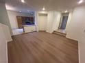 The spacious living room flows seamlessly into the kitchen, boasting hardwood floors and ample natural light at 6545 Netherseal Ave, Las Vegas, NV 89139