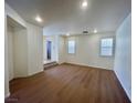 An open-concept living room features hardwood floors, recessed lighting, and a bright, inviting atmosphere at 6545 Netherseal Ave, Las Vegas, NV 89139