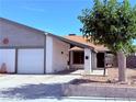 Inviting single story home showcasing its tidy front yard and well-maintained exterior at 7123 Kenwood St, Las Vegas, NV 89147