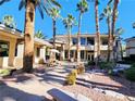 Beautiful courtyard with outdoor seating, manicured landscaping, and walkways creating a serene and inviting communal space at 7135 S Durango Dr # 314, Las Vegas, NV 89113