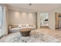 Bright living room with neutral decor, hardwood floors, and a large rug at 8411 Carmel Ridge Ct, Las Vegas, NV 89113