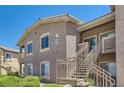 Exterior of building with stairs, multiple windows, and well-maintained green bushes at 8805 Jeffreys St # 2073, Las Vegas, NV 89123