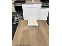 Image showcases flooring samples, including luxury vinyl plank, carpet, and quartz countertops at 9649 Hinson St, Las Vegas, NV 89139