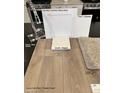 Showcasing sleek chrome faucet, white cabinets, and luxury vinyl plank flooring at 9649 Hinson St, Las Vegas, NV 89139
