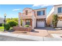 Two-story home boasts a charming balcony and an attached one-car garage at 9753 Villa Lorena Ave, Las Vegas, NV 89147