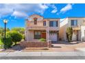 Inviting two-story home with a balcony and well-maintained front yard at 9753 Villa Lorena Ave, Las Vegas, NV 89147