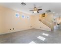 Open living room with tile floors, neutral walls, and natural lighting at 9753 Villa Lorena Ave, Las Vegas, NV 89147